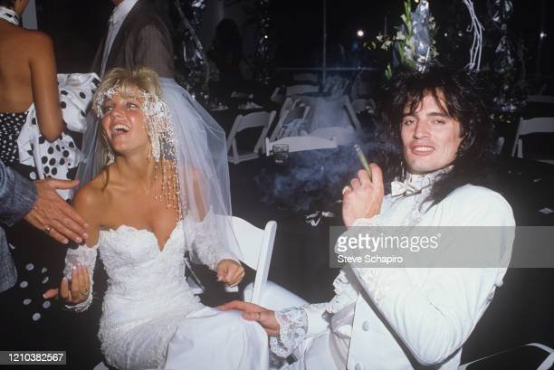 https://media.gettyimages.com/photos/view-of-american-actress-heather-locklear-and-musician-tommy-lee-as-picture-id1210382567?s=612x612