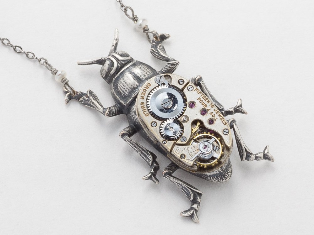 http://steampunknation.com/jewelry/steampunk-necklace-silver-beetle-bug-watch-movement-gears-pearl-pendant-necklace-unisex-men-womens-statement-steampunk-jewelry-166262489-1.jpg