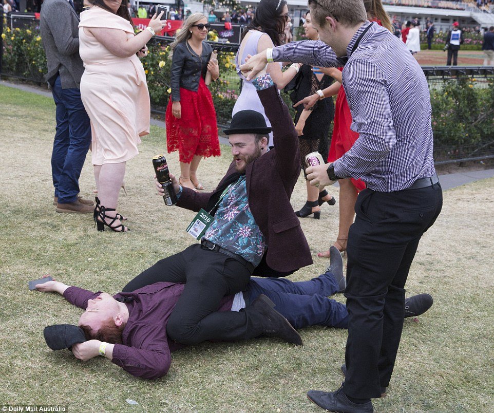 Some punters took the opportunity to enjoy the last day of the Melbourne Cup, like this man who is seen straddling another