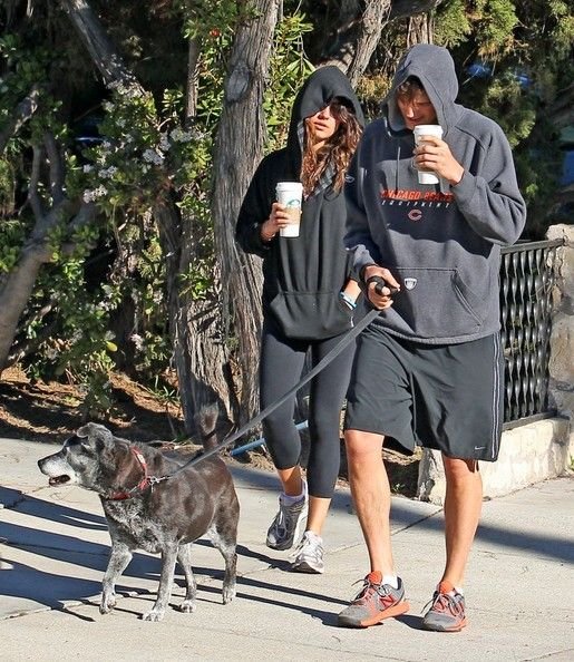 Mila Kunis Photos - Couple Ashton Kutcher & Mila Kunis take their dog for a walk in Hollywood, California on January 7th, 2013. Ashton and Mila are in no mood to be photographed and stay hidden inside of their hoodies. - Mila Kunis & Ashton Kutcher Hide Inside Of Their Hoodies