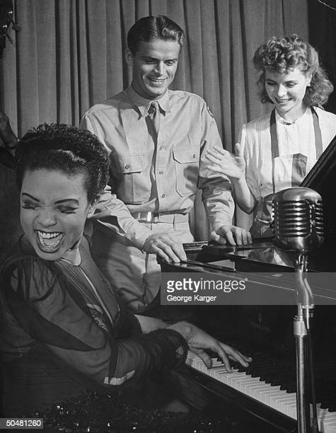 https://media.gettyimages.com/photos/actress-dorothy-mcguire-and-singer-hazel-scott-playing-host-to-men-picture-id50481260?s=612x612
