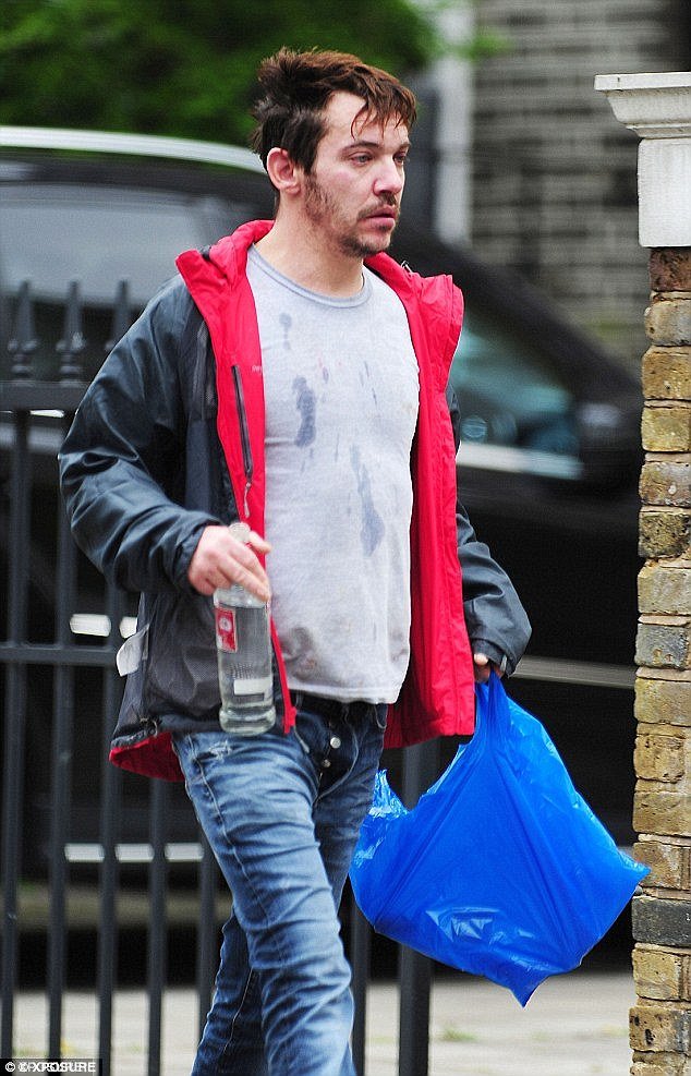 Disheveled: The 37-year-old hit headlines due to his scruffy and bleary-eyed appearance. He was photographed drinking vodka neat and explains that he is 'embarrassed', referring to the relapse as a 'mistake'