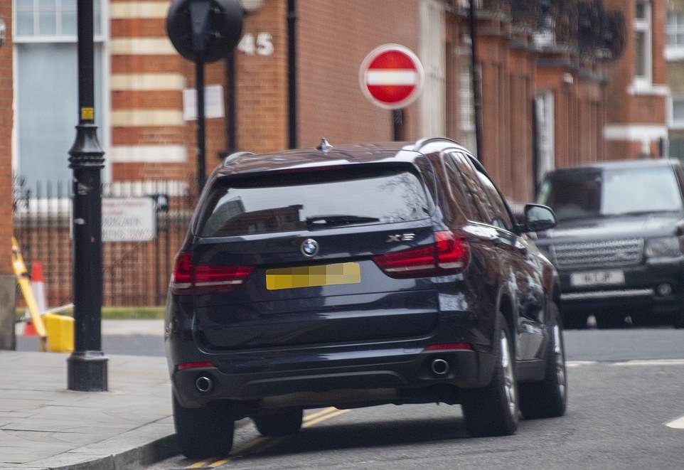 Parked: The driver repositioned the car so it was parked completely on the road for the Duchess of Cambridge's return
