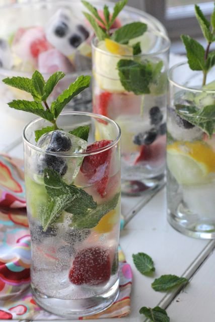 Spritzers with Fruit Ice Cubes - I love these fruit ice cubes for so many different beverages. They are perfect in a fruit punch, sparkly in a glass of lemonade and especially lovely in iced tea.: 