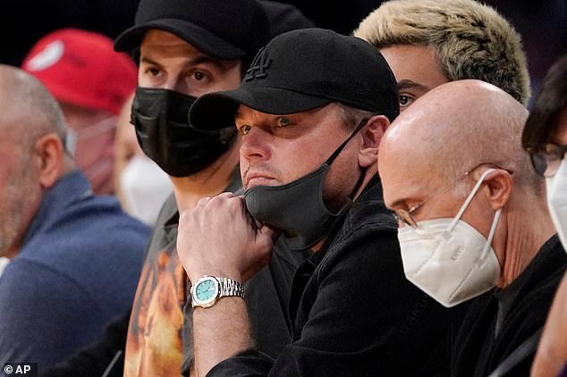 Slam-dunk: DiCaprio watched his local basketball team the LA Lakers take on the Portland Trail Blazers