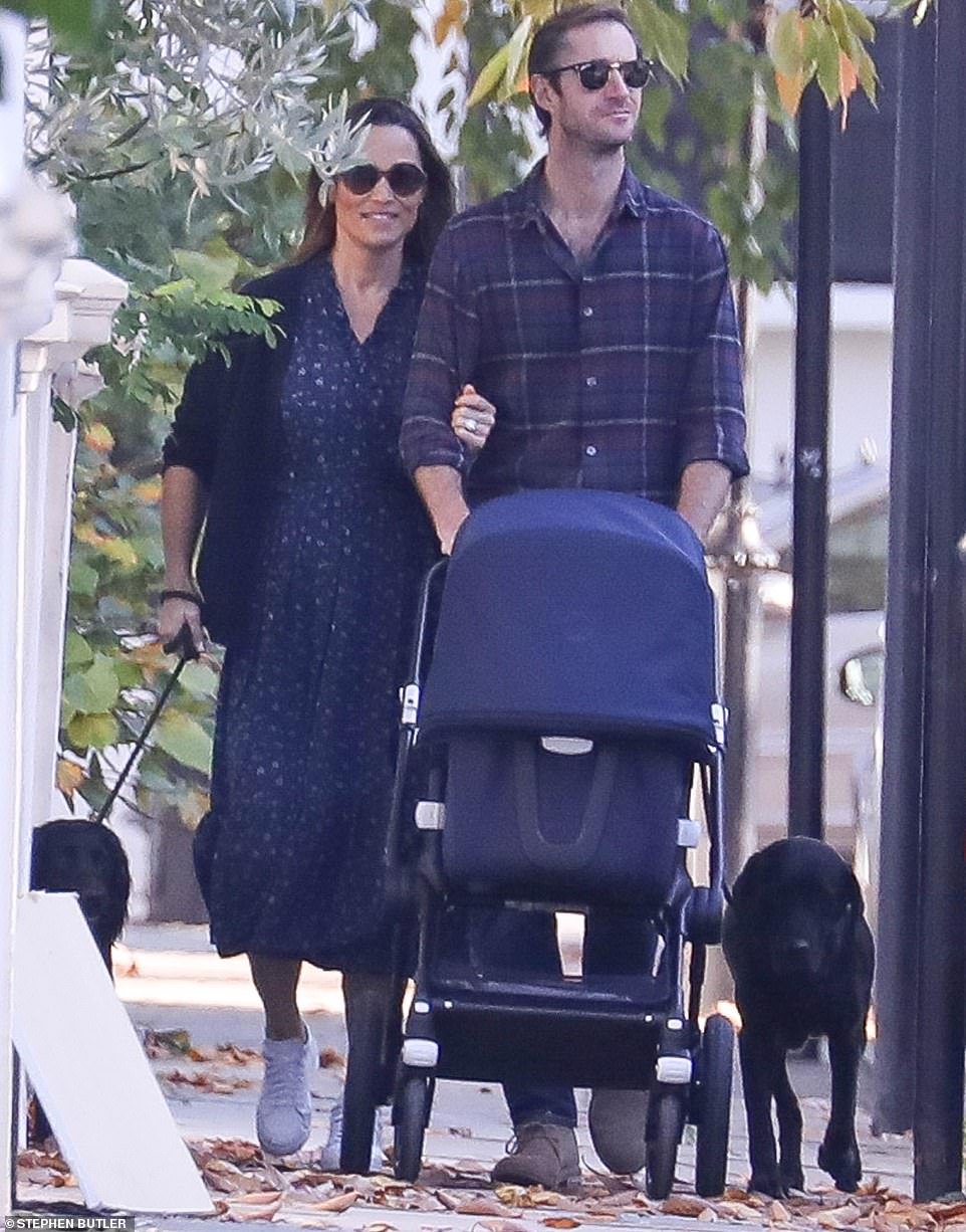 The new mother looked laid-back in a Â£350 day dress with ruffle detailing by favourite designer Kate Spade, which she wore under a long navy cardiganÂ 