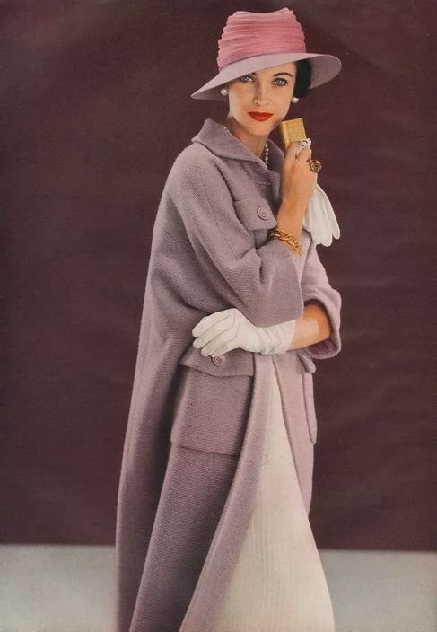 March Vogue 1957    Wearing a wool amethyst coat by Ben Zuckerman and a felt and chiffon hat by Lilly Daché.  Photo by Frances McLaughlin-Gill