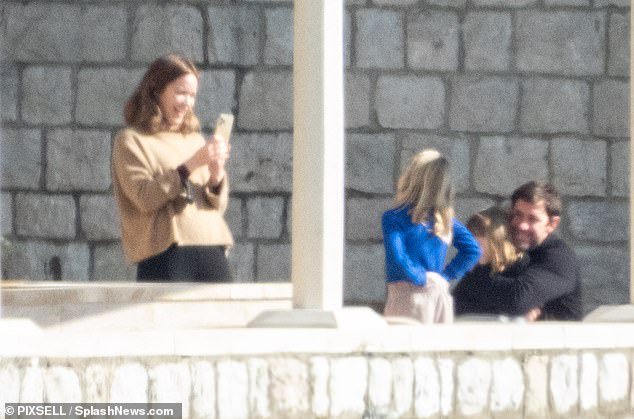 Fun: Emily Blunt looked every inch the doting mother as she took some sweet snaps of John Krasinski with their daughters in Dubrovnik on Sunday