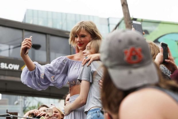 Taylor Swift at the new Kelsey Montague What Lifts You Up Mural -04
