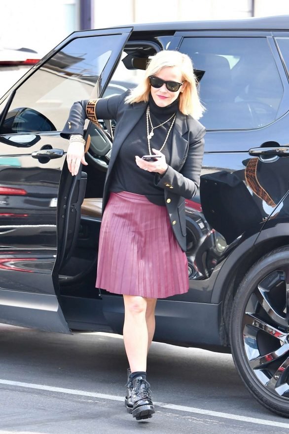 Reese Witherspoon 2019 : Reese Witherspoon – Wears a pleated purple skirt at her office with her bulldog-05