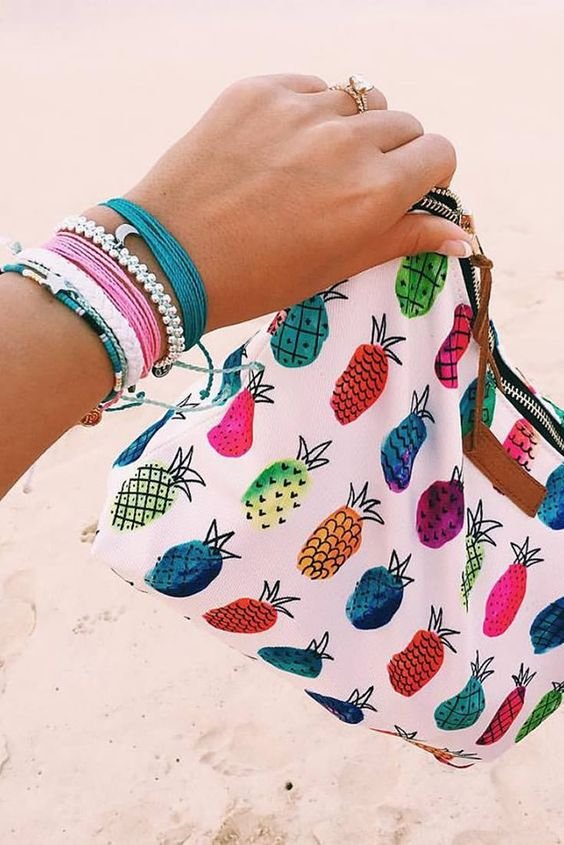 Our Pineapple Clutch + Stack of Pura Vida Bracelets Use the code BRIDGETKARCHER20 to get 20% off: 