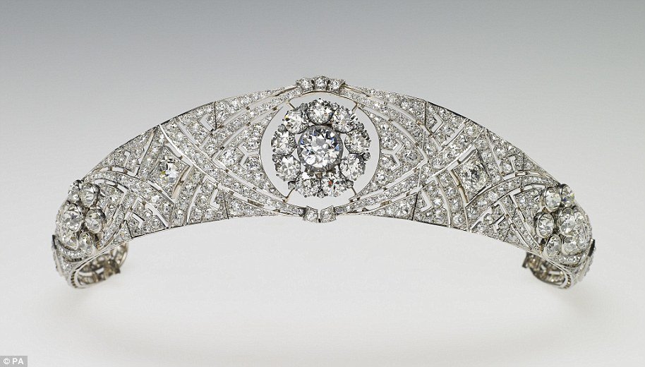 The bandeau, chosen from Her Majesty's collection, is formed as a flexible band of eleven sections, pierced with interlaced ovals and pavÃ set with large and small brilliant diamonds