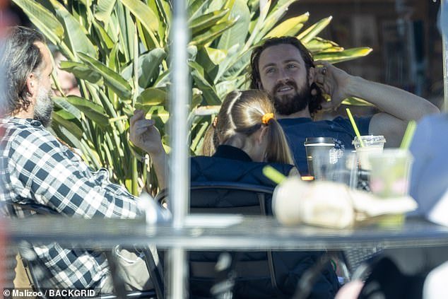 Handsome: English actor Aaron Taylor-Johnson was seen enjoying the sunshine while grabbing coffee with friends and his wife Sam in Malibu, California on Sunday afternoon