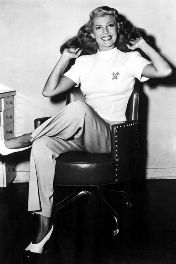 Rita Hayworth, 1940  The actress embraces androgynous style in a pair of wide-legged trousers and monochrome flats in 1940. Our new workwear wardrobe = sorted.   Read more at http://www.marieclaire.co.uk/fashion/1940s-fashion-the-decade-captured-in-40-incredible-pictures-108160#MhJD40oFwUY6BX4U.99