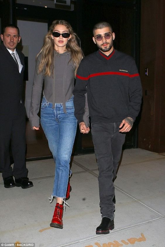 Besotted: Gigi Hadid and Zayn Malik appeared closer than ever on Thursday as they headed out hand in hand in New York City