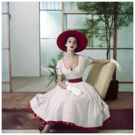 Jean Patchett in red and white polka dot summer dress with petticoat ruffle, hat and gloves Photo Frances Mclaughlin-Gill