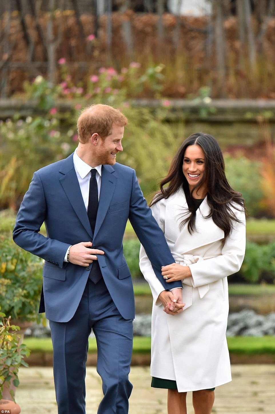 Meghan and Harry looked delighted as she took to Kensington Palace gardens to deliver the good news