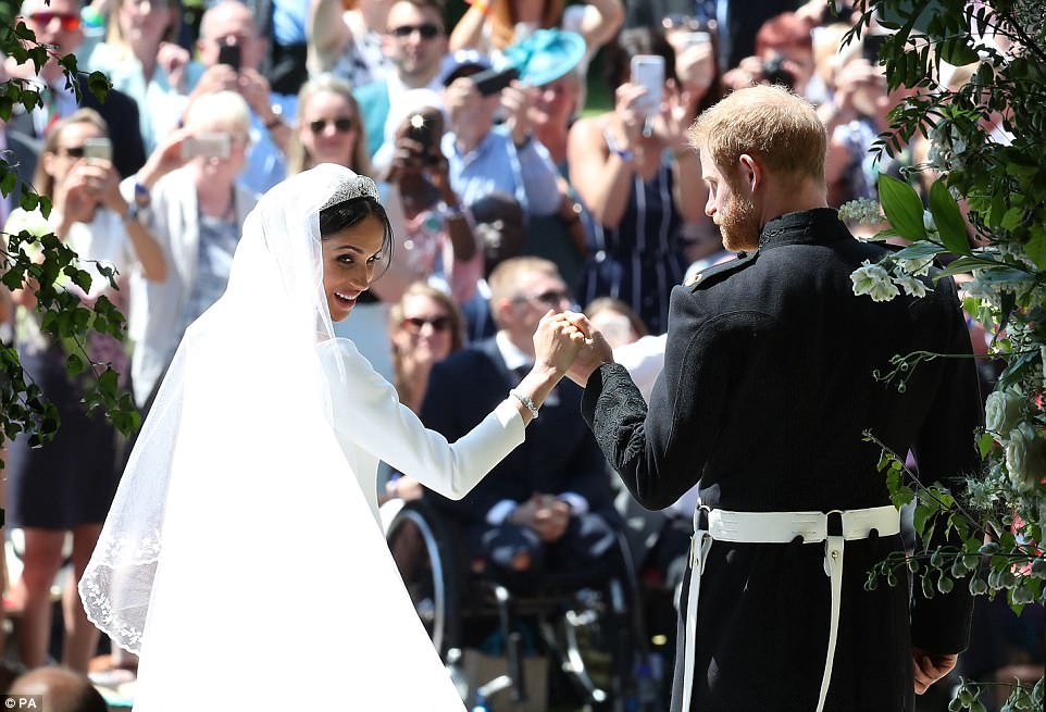 Picture of happiness! Meghan was beaming from ear to ear ahead of the carriage processionÂ 