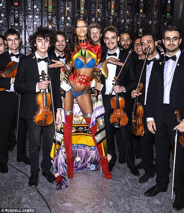 Paris: Brazilian model, Lais Ribeiro, 26, who earned her wings in 2015, poses with the orchestra at the 2016 show in Paris