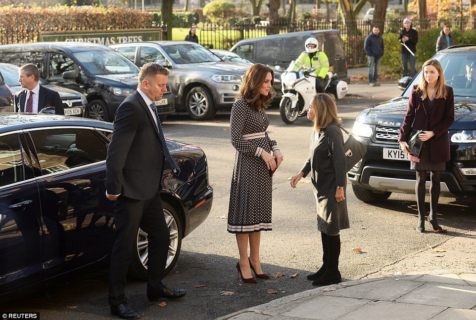 Kate displayed a hint of a baby bump in her designer dress as she arrived at the museum in a chauffeur-driven car 