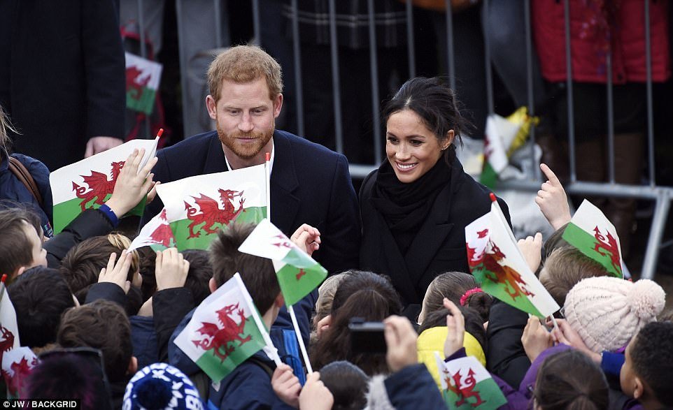 Cheering crowds shower Meghan and Harry with kisses, hugs and curtseys having waited all morning for their arrival