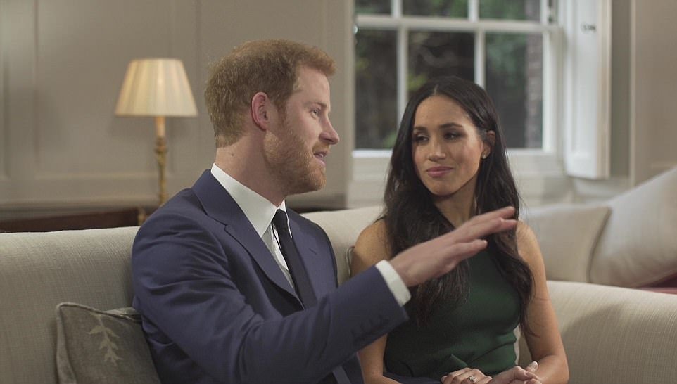 Meghan stares lovingly at Prince Harry as he explains how the couple were first introduced by a mystery woman and mutual friend to them both