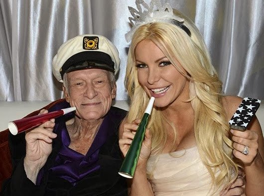 Octogenarian Playboy founder Hugh Hefner poses with his bride Crystal Harris as they ring in the new year at their wedding in Beverly Hills...Octogenarian Playboy founder Hugh Hefner poses with his bride Crystal Harris as they ring in the new year at their wedding at the Playboy Mansion in Beverly Hills, California in this handout photo taken on December 31, 2012. Hefner briefly swapped his iconic silk pajamas for a tuxedo to marry Harris, the one-time 