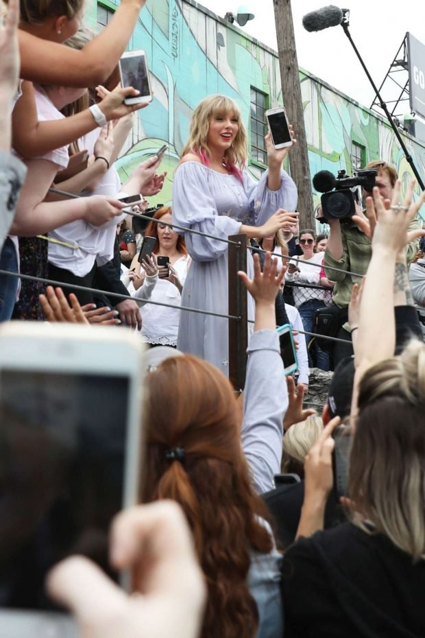 Taylor Swift at the new Kelsey Montague What Lifts You Up Mural -05