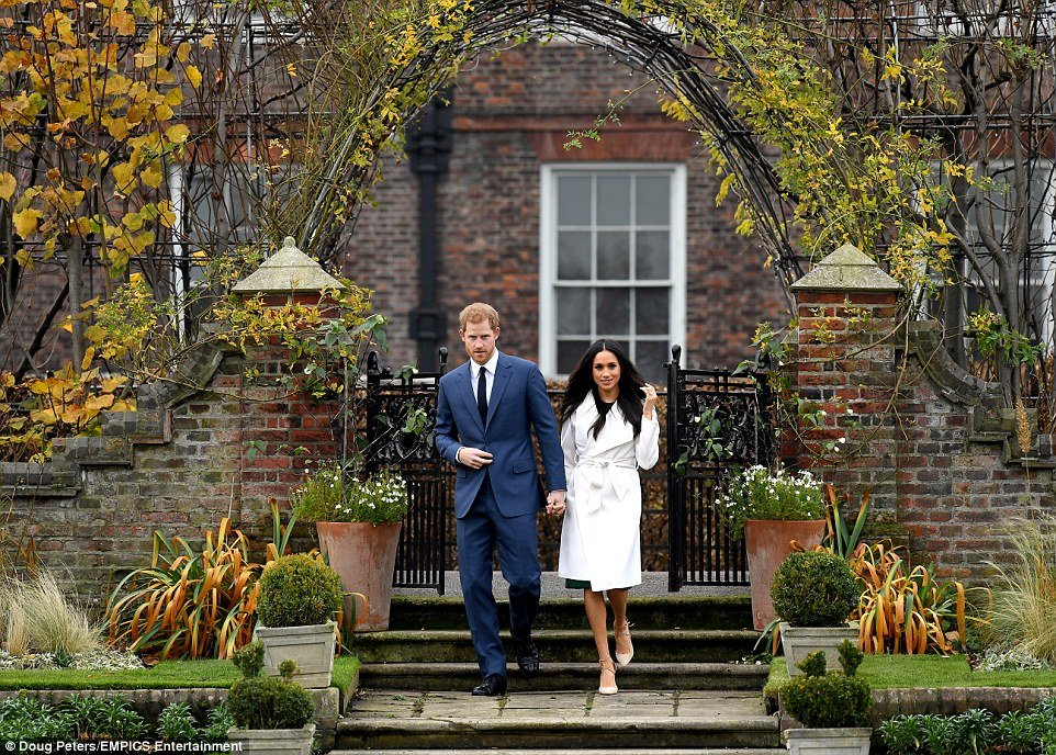 Harry, wearing a blue suit and tie, said he was 'thrilled' as he expressed his love for Meghan, who he will marry next year